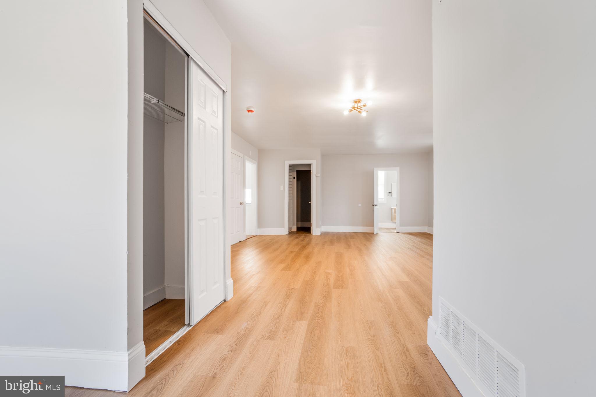 246 Chestnut Street Mount Holly, NJ 08060 - Photo 6 of 25 a view of a room with wooden floor and a window
