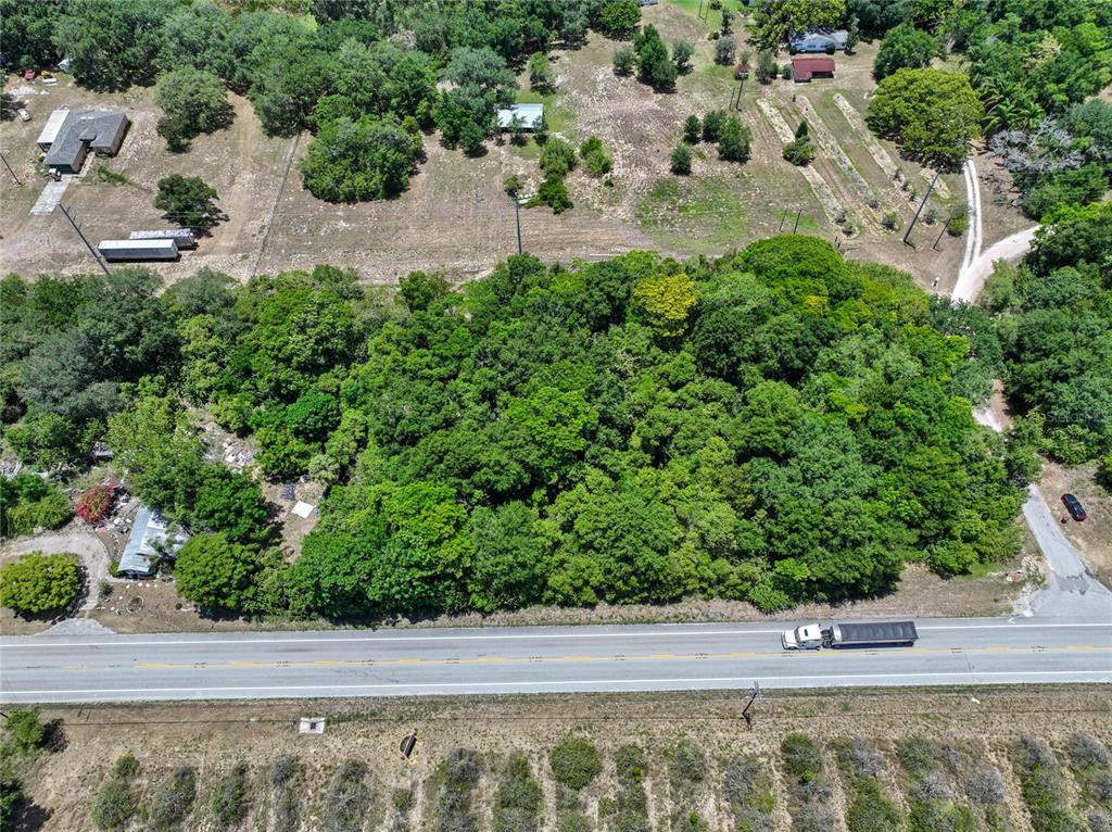 Sr-17 Dundee, FL 33838 - Photo 10 of 15 an aerial view of a house with a yard and lake view