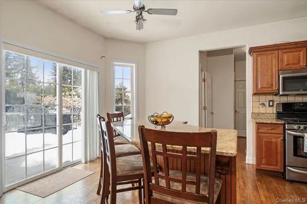 a dining room with furniture and wooden floor