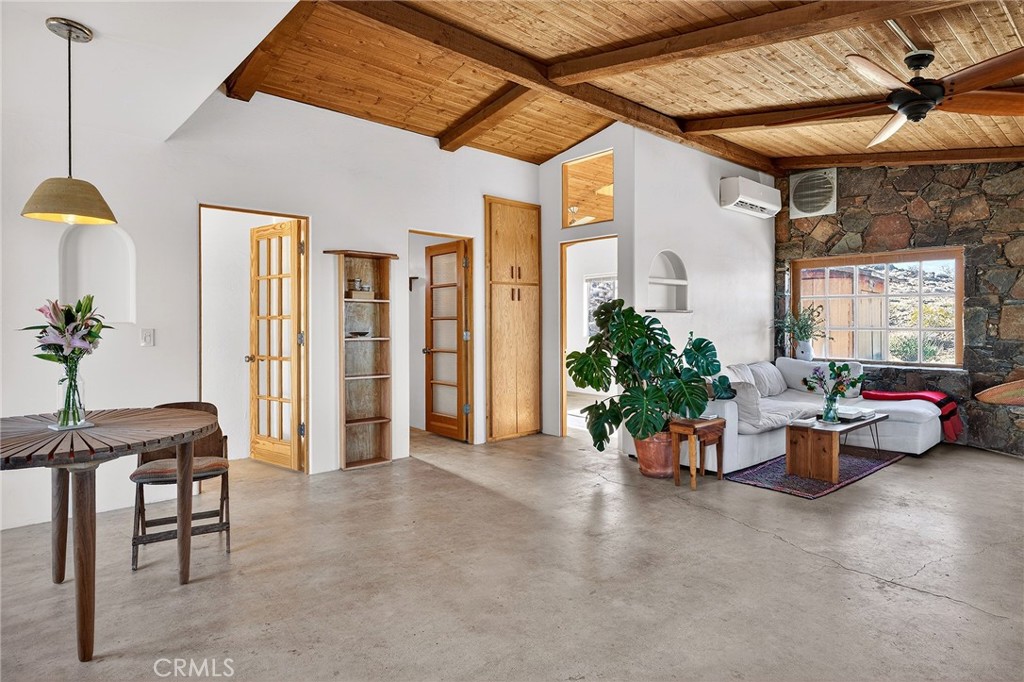 60473 Starlight Road Joshua Tree, CA 92252 - Photo 18 of 39 a living room with furniture and wooden floor