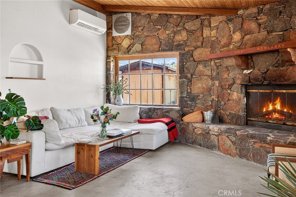 60473 Starlight Road Joshua Tree, CA 92252 - Photo 5 of 39 a living room with furniture and a fireplace