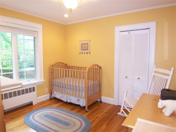 36 Dolphin Road Newton, MA 02459 - Photo 13 of 17 a living room with a baby crib furniture and a window