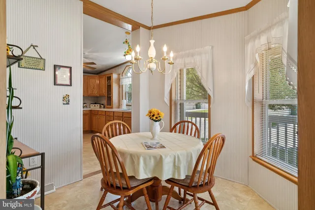 a bedroom with a bed a window and dresser