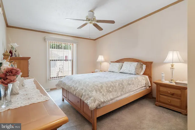 a large bed in a white room