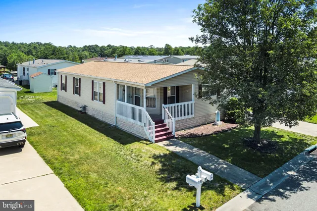a aerial view of a house with a yard