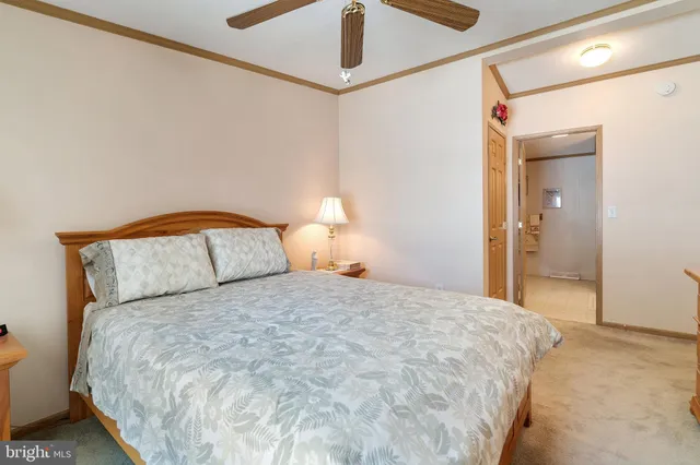 a view of walk in closet with clothes