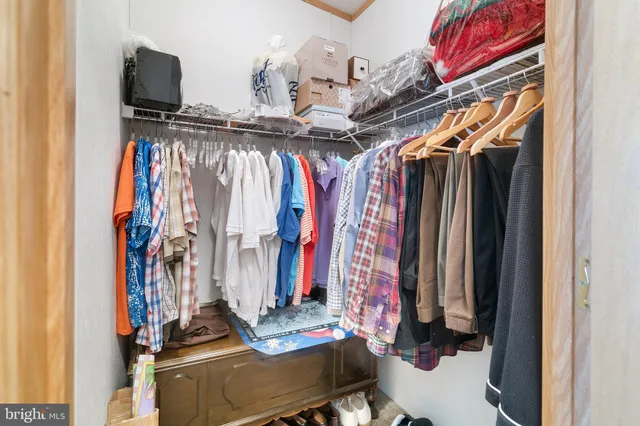 a bathroom with a sink and mirror with toilet
