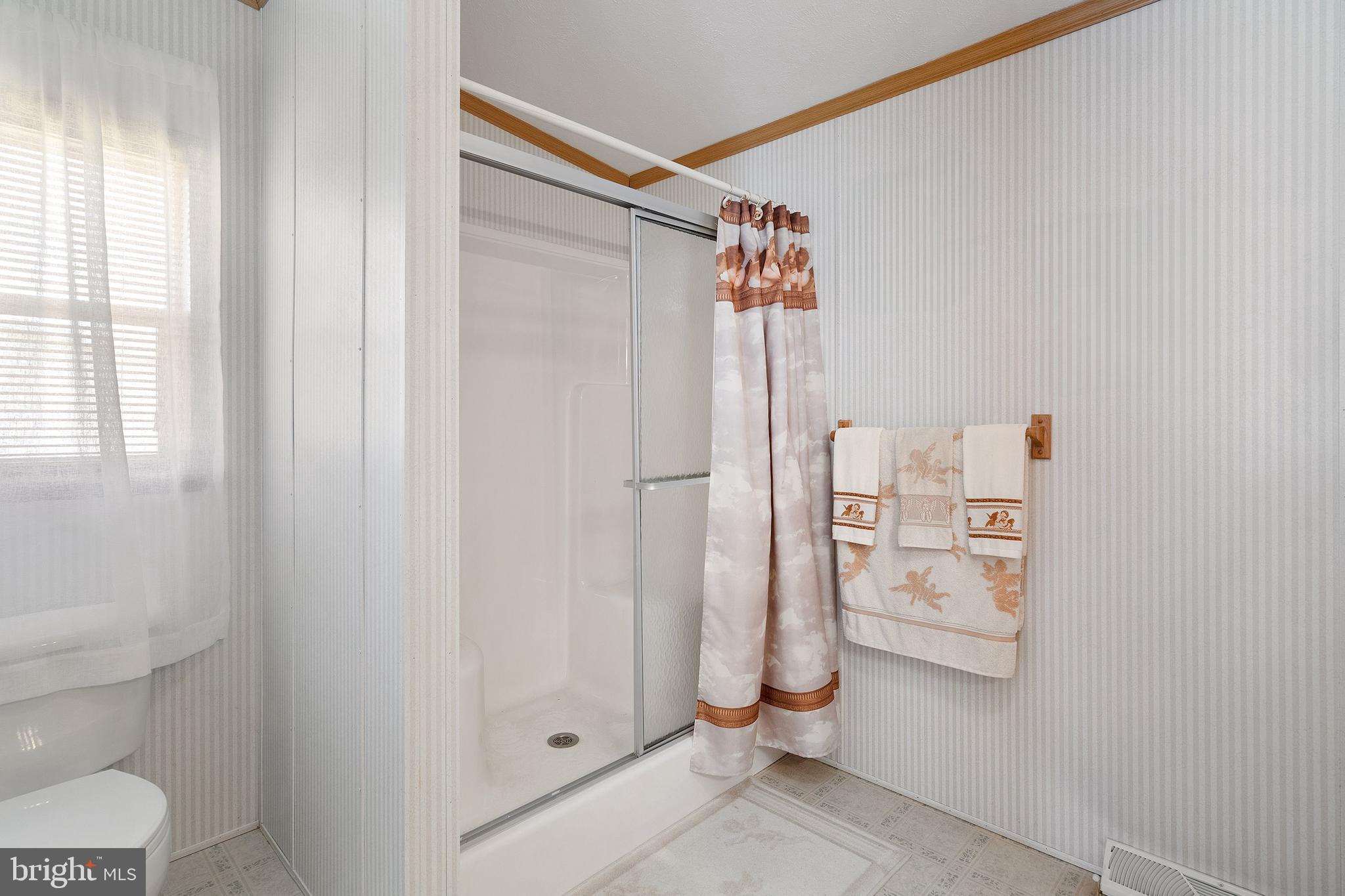 1104 Sycamore Court Whiting, NJ 08759 - Photo 24 of 54 a bathroom with a shower and a toilet