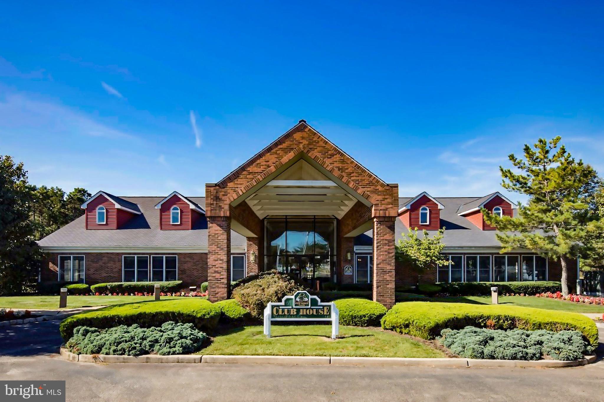 1104 Sycamore Court Whiting, NJ 08759 - Photo 40 of 54 a front view of a building with a garden