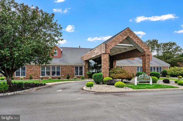 a swimming pool with trees in the background