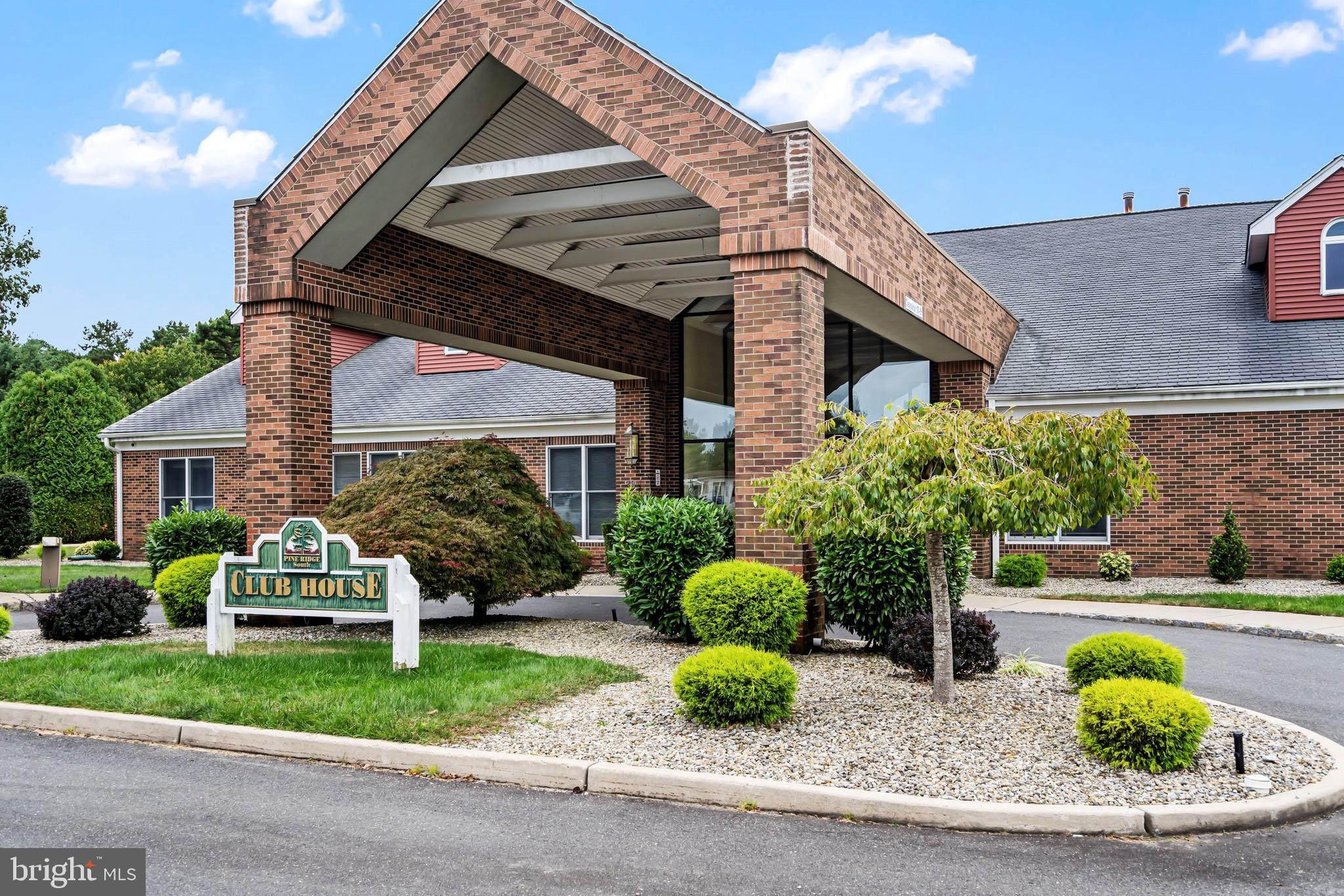 1104 Sycamore Court Whiting, NJ 08759 - Photo 42 of 54 a front view of a house with a yard and potted plants