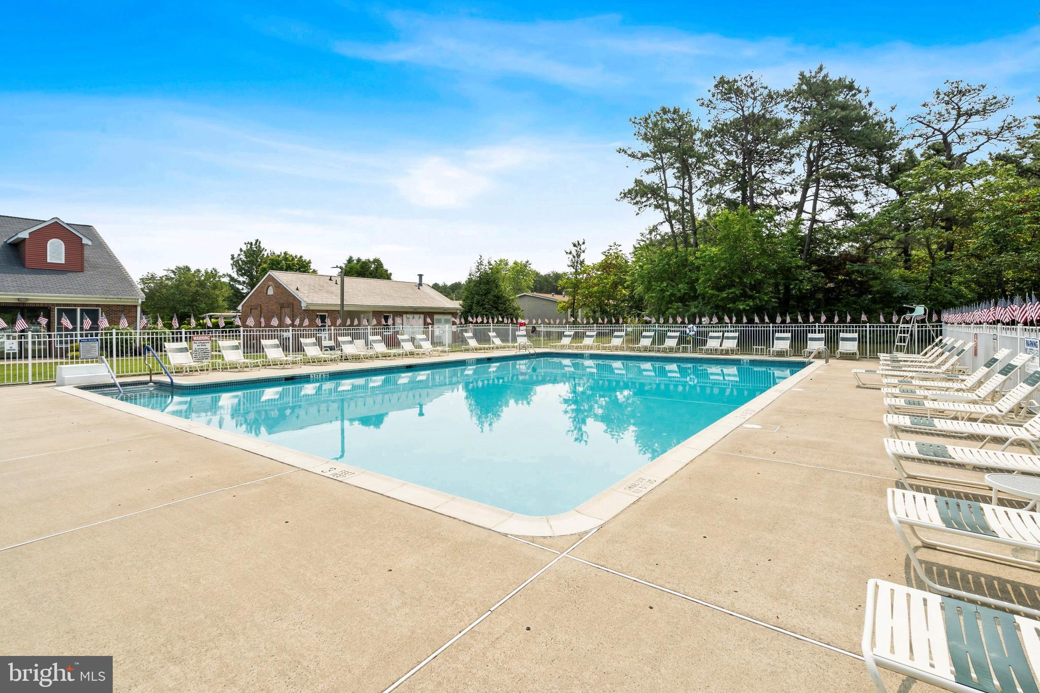 1104 Sycamore Court Whiting, NJ 08759 - Photo 46 of 54 a view of a swimming pool and lounge chair