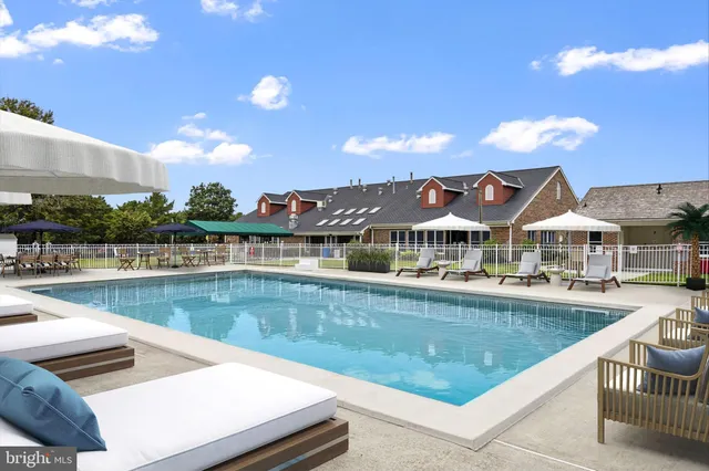 a view of a garden with sitting area