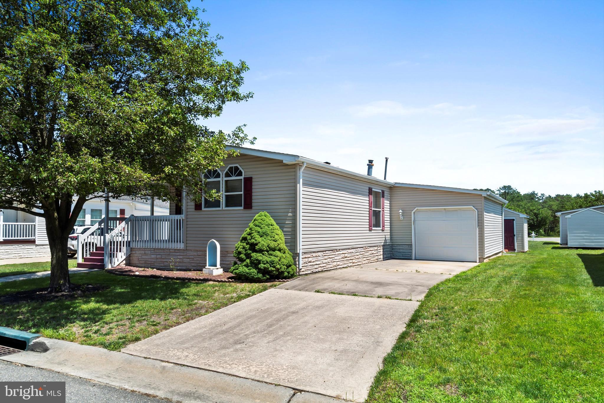 1104 Sycamore Court Whiting, NJ 08759 - Photo 7 of 54 front view of a house with a yard