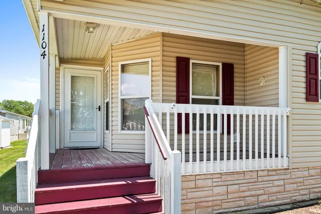 a view of a balcony with wooden floor and stairs