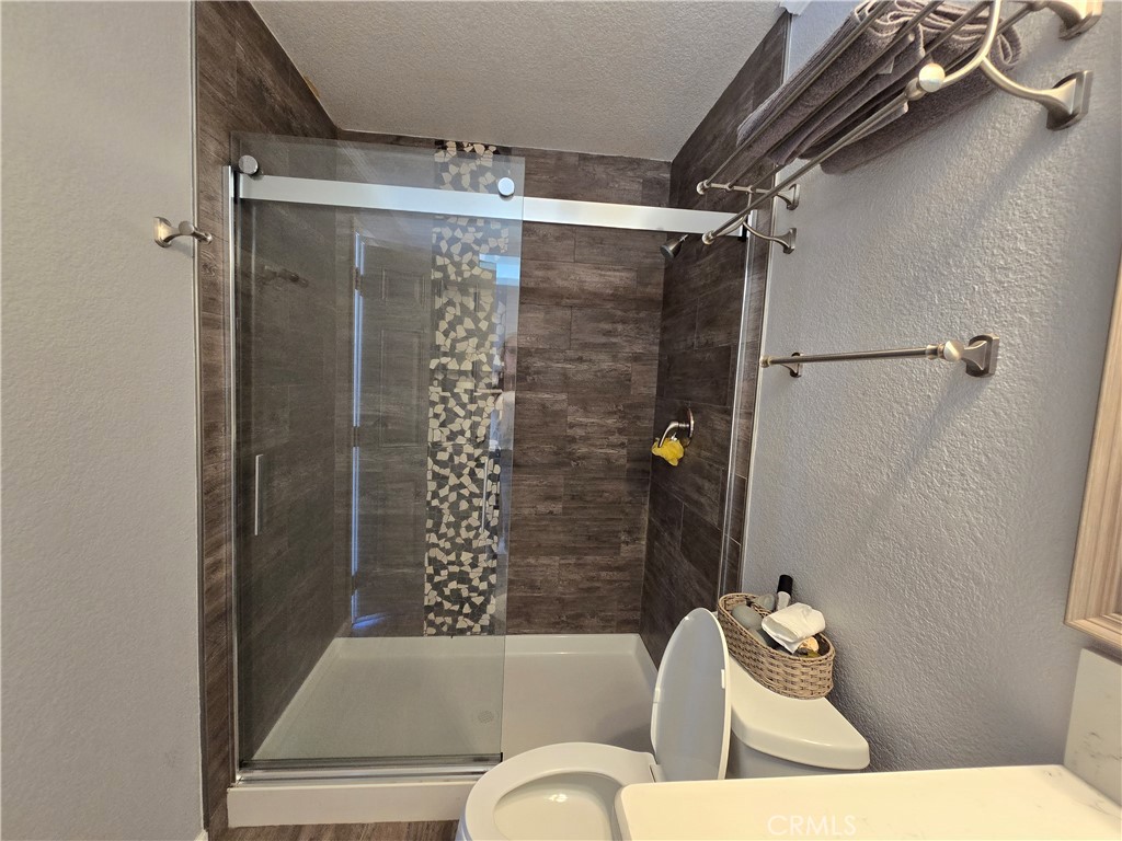 5995 West Brooks Road Merced, CA 95341 - Photo 12 of 20 a bathroom with a toilet and shower