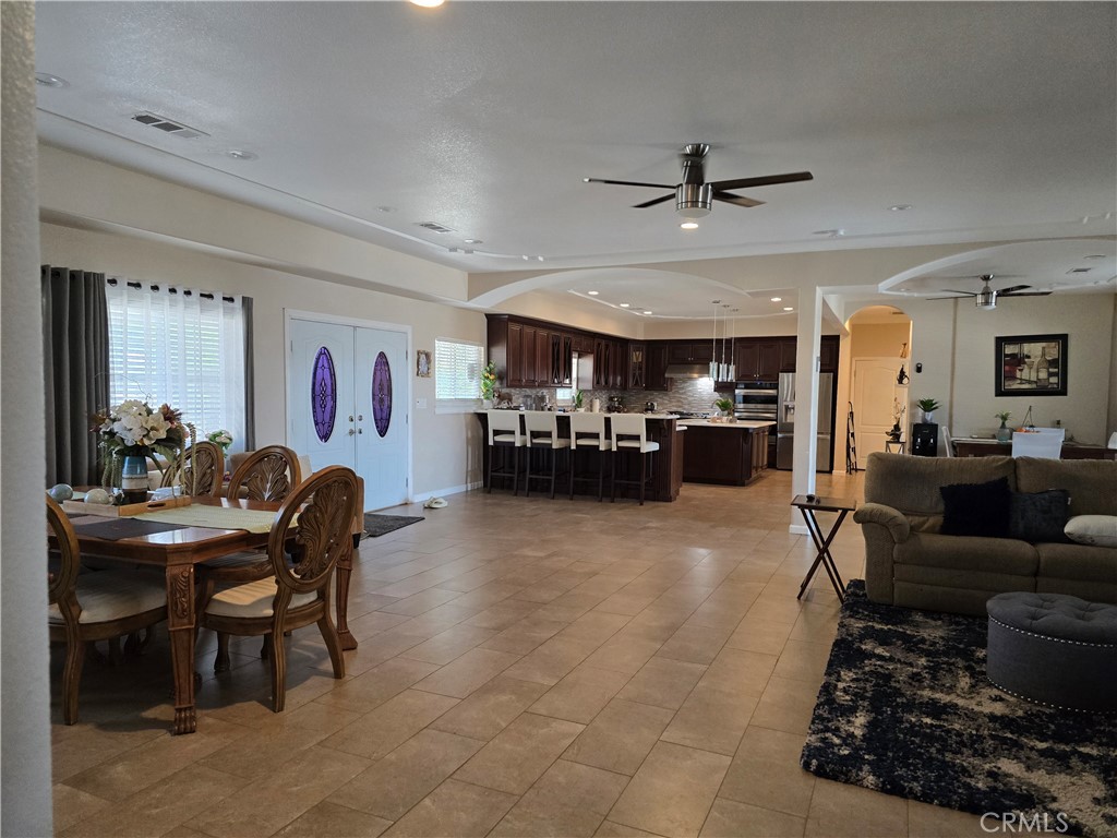5995 West Brooks Road Merced, CA 95341 - Photo 20 of 20 a living room with furniture and a dining area with kitchen view