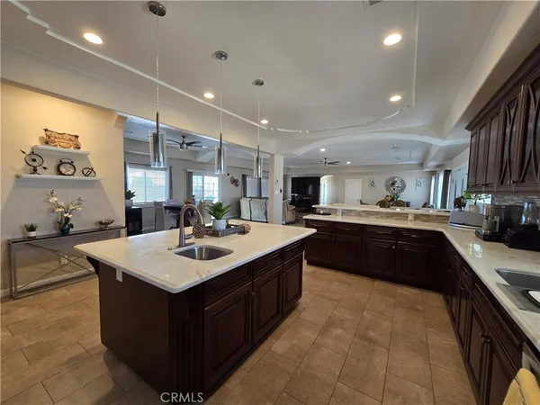 a kitchen with a sink a counter top space and appliances