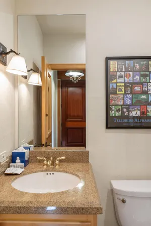 a bedroom with a bed and flat screen tv