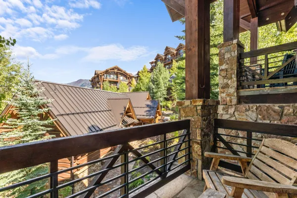 a view of a balcony with chairs