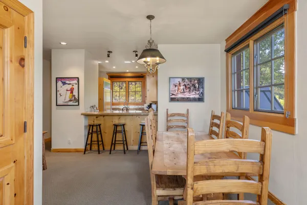 a kitchen with a sink and a refrigerator