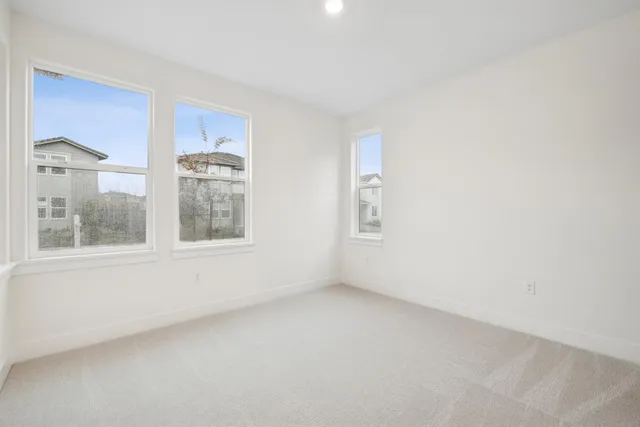 a view of empty room with windows