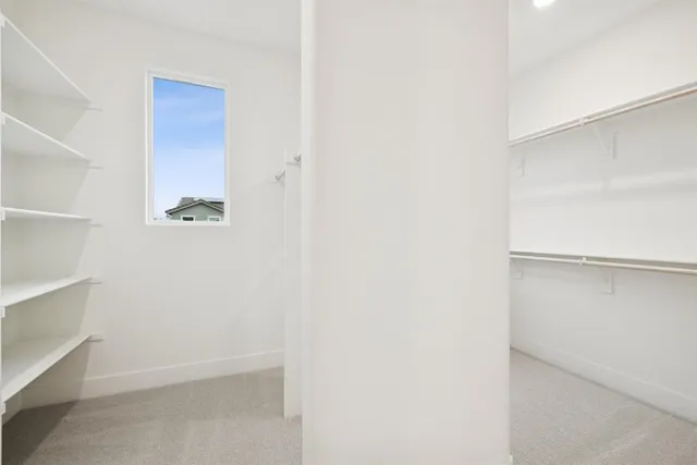 a view of an empty walk in closet