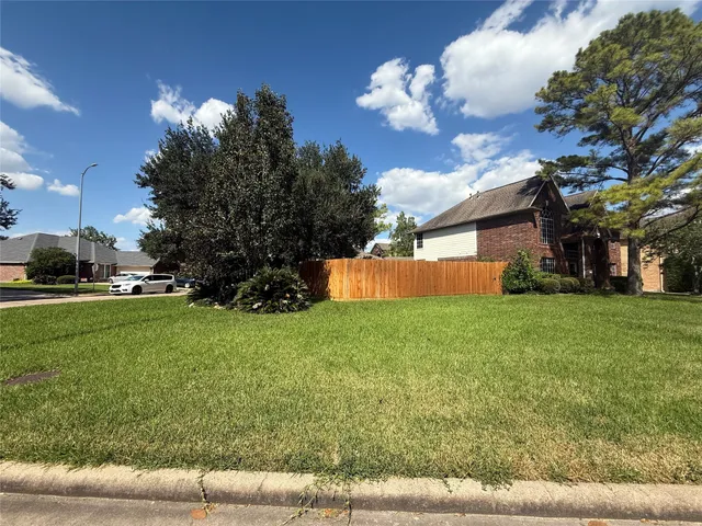 a backyard of a house with lots of green space