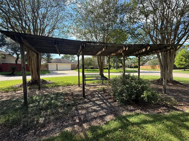 a view of a backyard with swimming pool