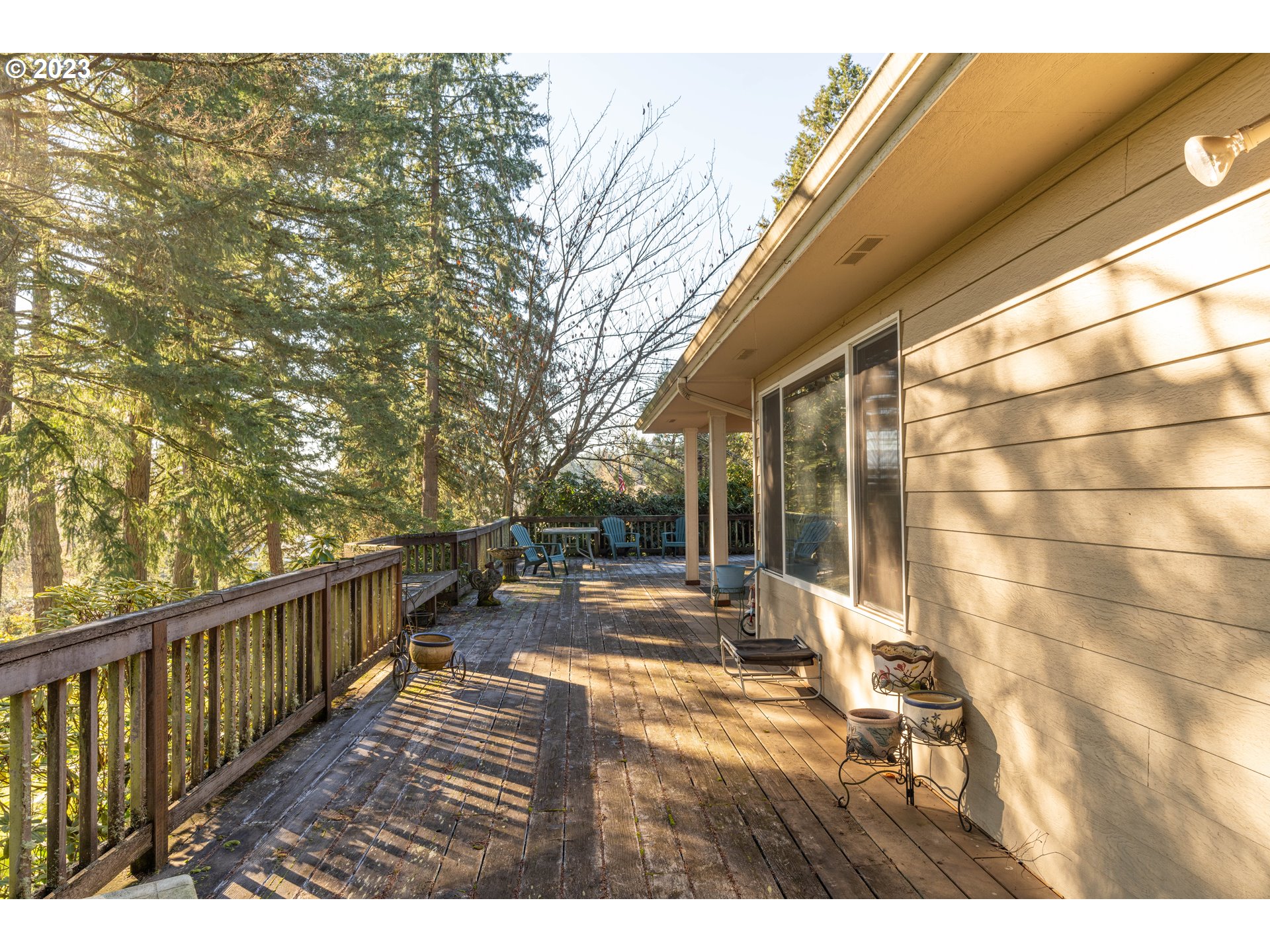 90532 Hill Road Springfield, OR 97478 - Photo 14 of 37 a view of a patio with wooden floor and fence
