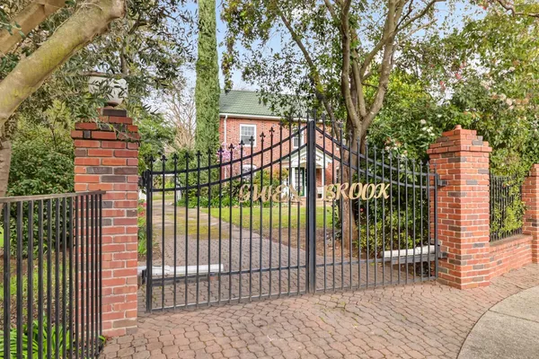 a view of house with yard and entertaining space