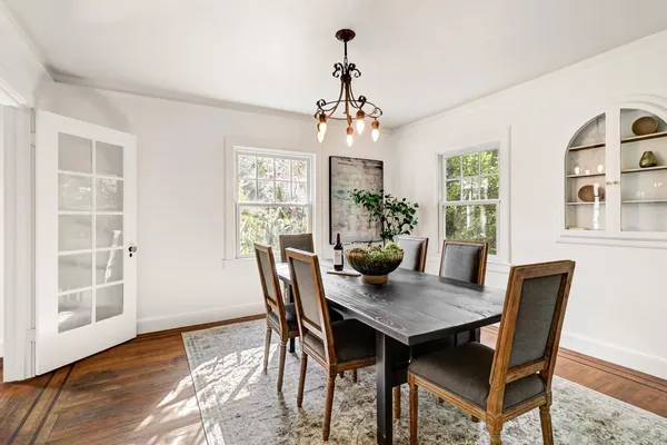 a kitchen with granite countertop a stove a sink and a refrigerator