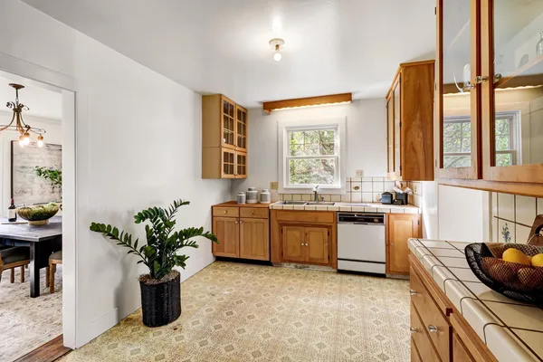a view of a dining room with furniture window and outside view