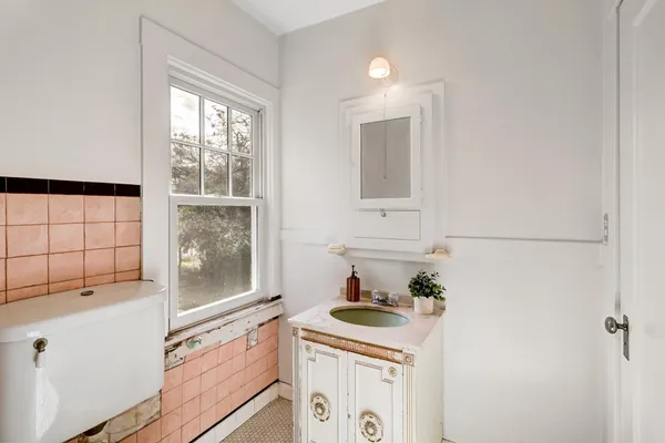 a bed room with a bed and a lamp