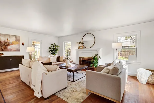 a view of a livingroom with furniture window and wooden floor