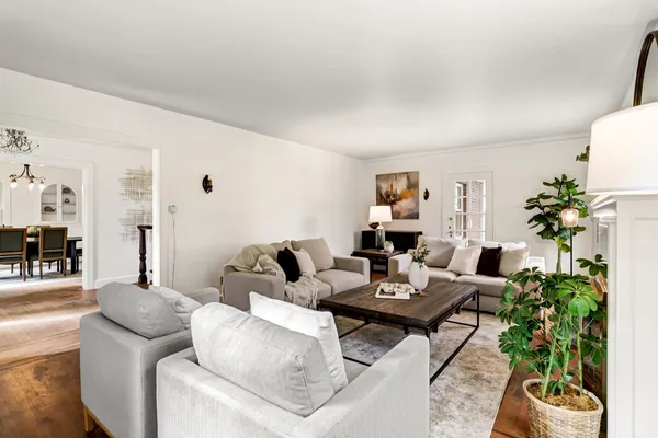 a view of a dining room with furniture window and wooden floor
