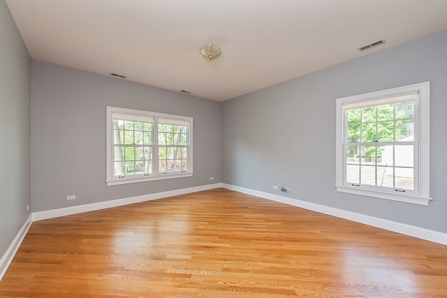 330 Greenleaf Avenue Wilmette, IL 60091 - Photo 17 of 23 a view of an empty room with wooden floor and a window
