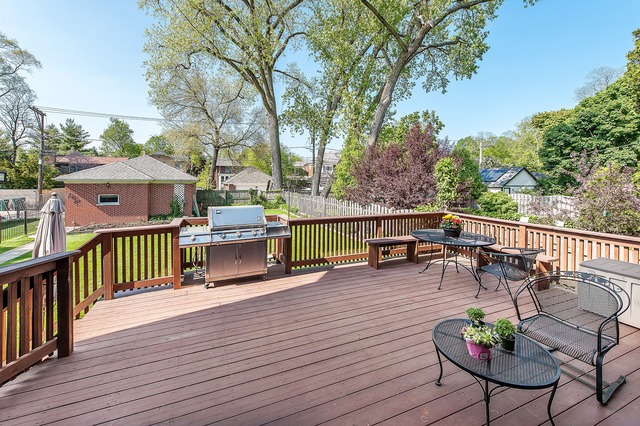 330 Greenleaf Avenue Wilmette, IL 60091 - Photo 2 of 23 a view of a deck with chairs and wooden fence