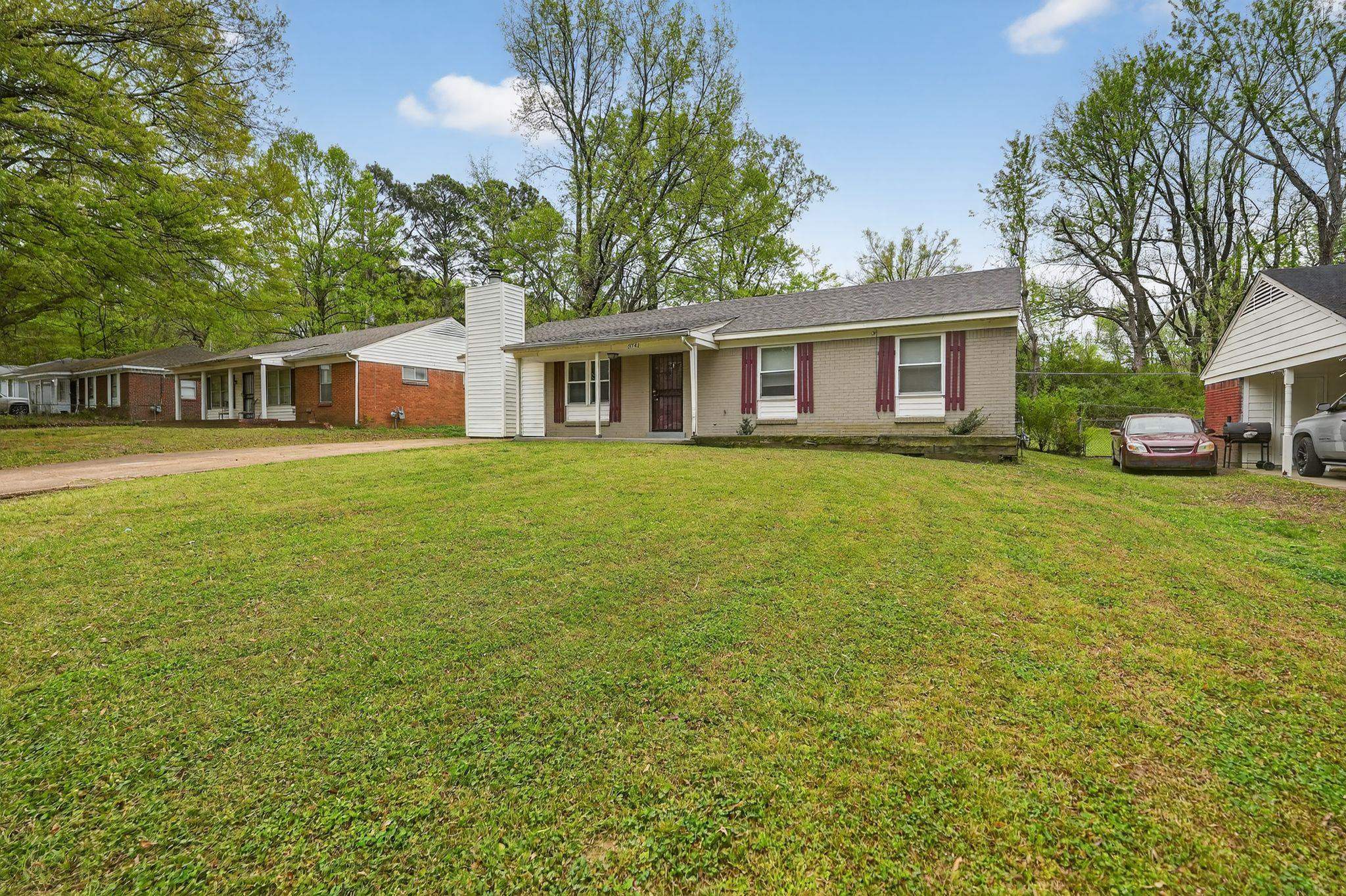 3741 Ridgemont Road Memphis, TN 38128 - Photo 3 of 32 Single story home with brick siding, a front yard, and a chimney