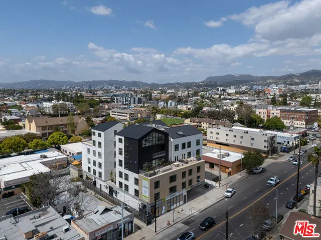 an aerial view of a building with city view