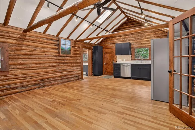 a view of a room with wooden floor