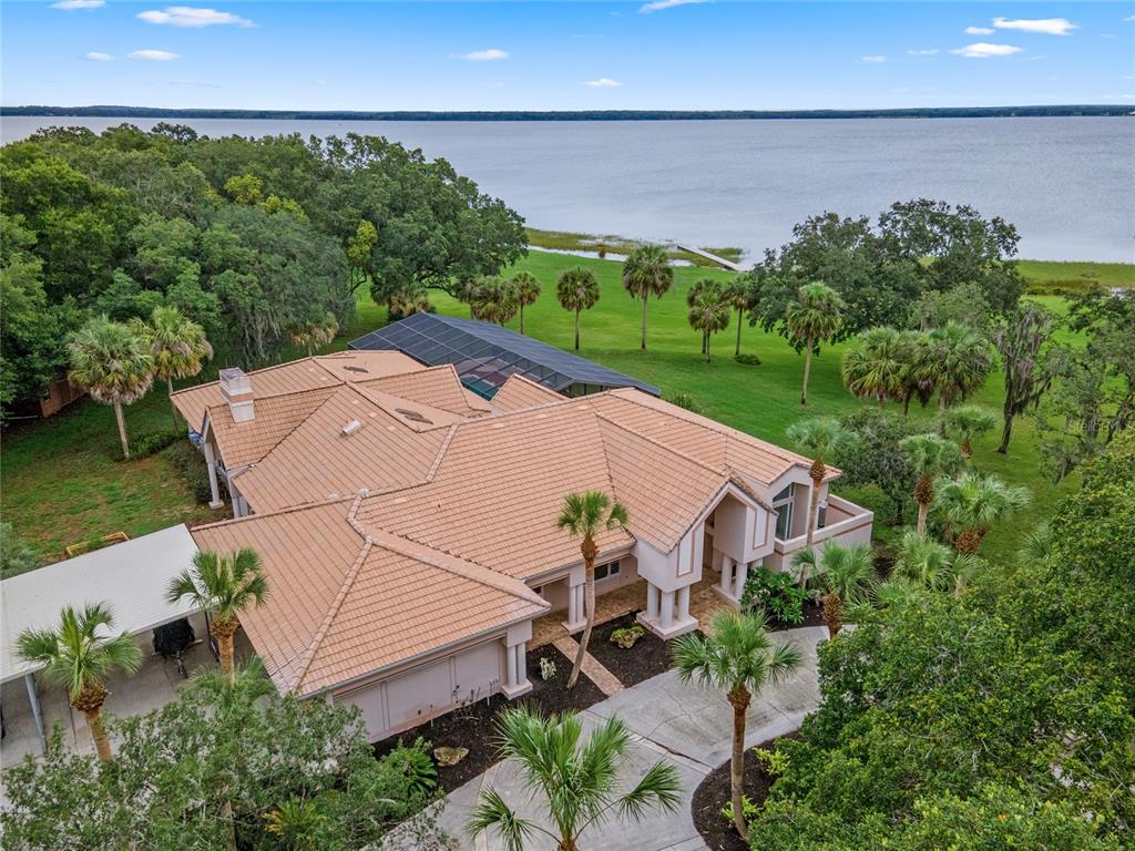 37940 Apiary Road Grand Island, FL 32735 - Photo 1 of 67 an aerial view of a house with a yard