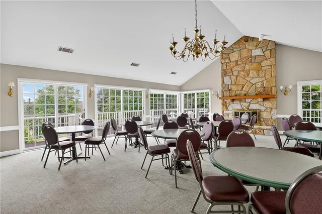 a view of a dining room with furniture window and outside view