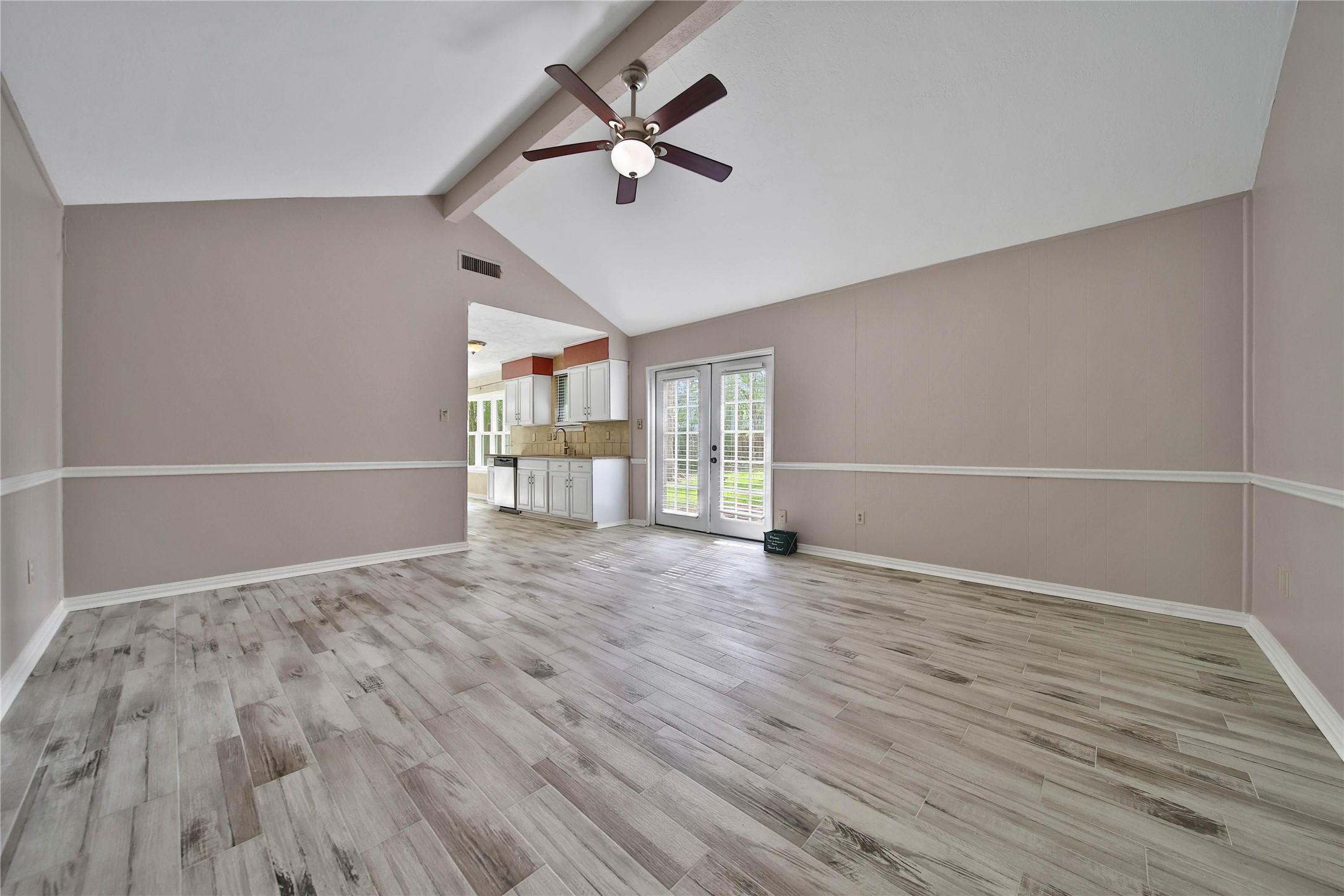 2006 Mermaid Lane Houston, TX 77062 - Photo 5 of 35 an empty room with wooden floor and windows