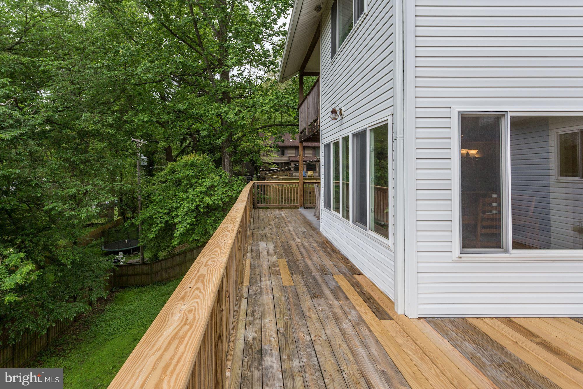 423 Mountain Road Crownsville, MD 21032 - Photo 18 of 69 Large Deck stretches across the back of the house