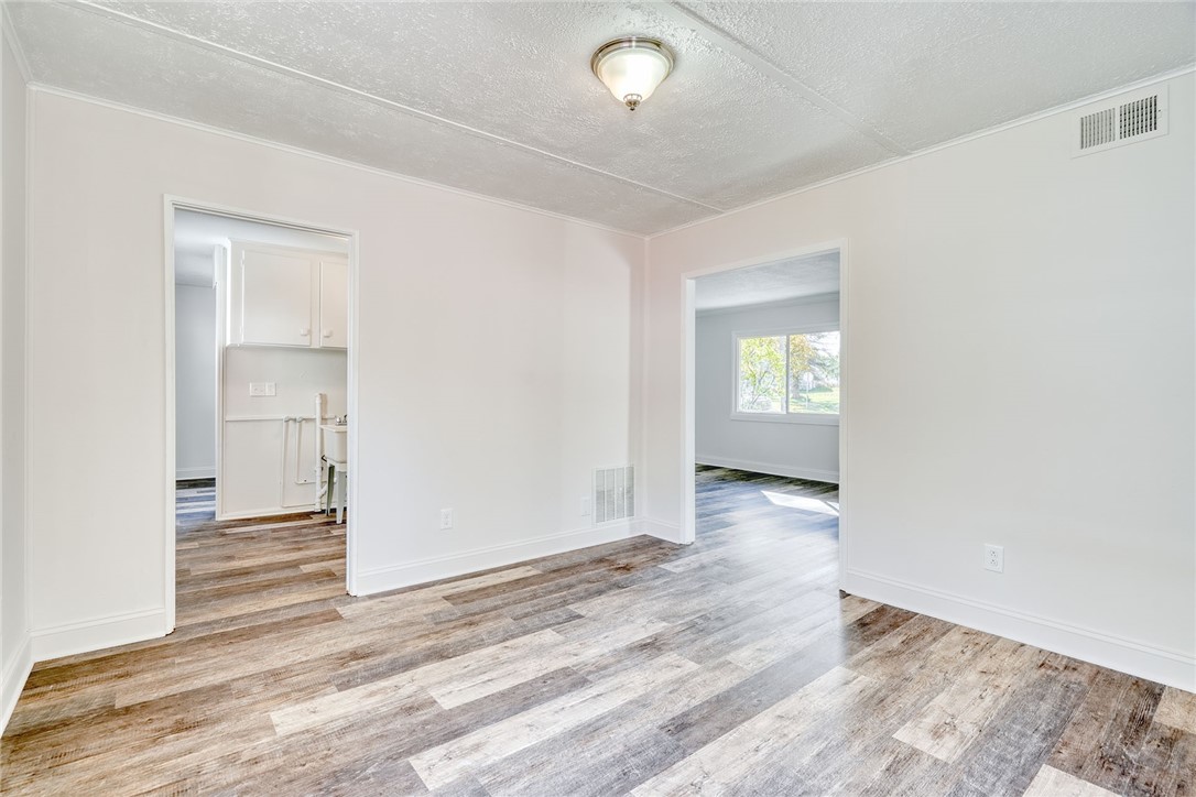 29 Seneca Street Webster, NY 14580 - Photo 22 of 44 FORMAL DINING VIEW TO UTILITY ROOM AND LIVING ROOM
