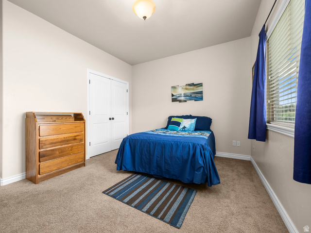 255 East 1200 North Mapleton, UT 84664 - Photo 20 of 37 Bedroom featuring neutral wall paint, light brown carpeting, white baseboards, and a window with blinds