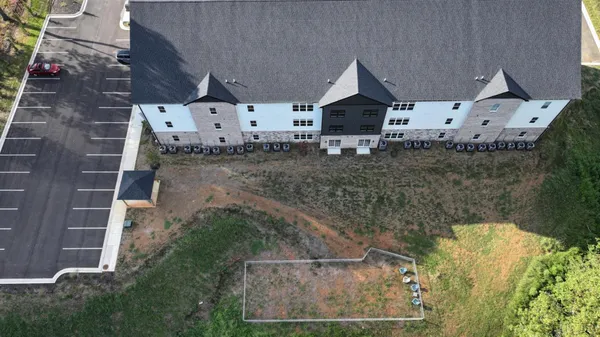 a view of house with yard