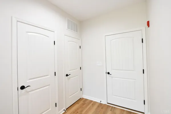 a view of kitchen with sink microwave and refrigerator