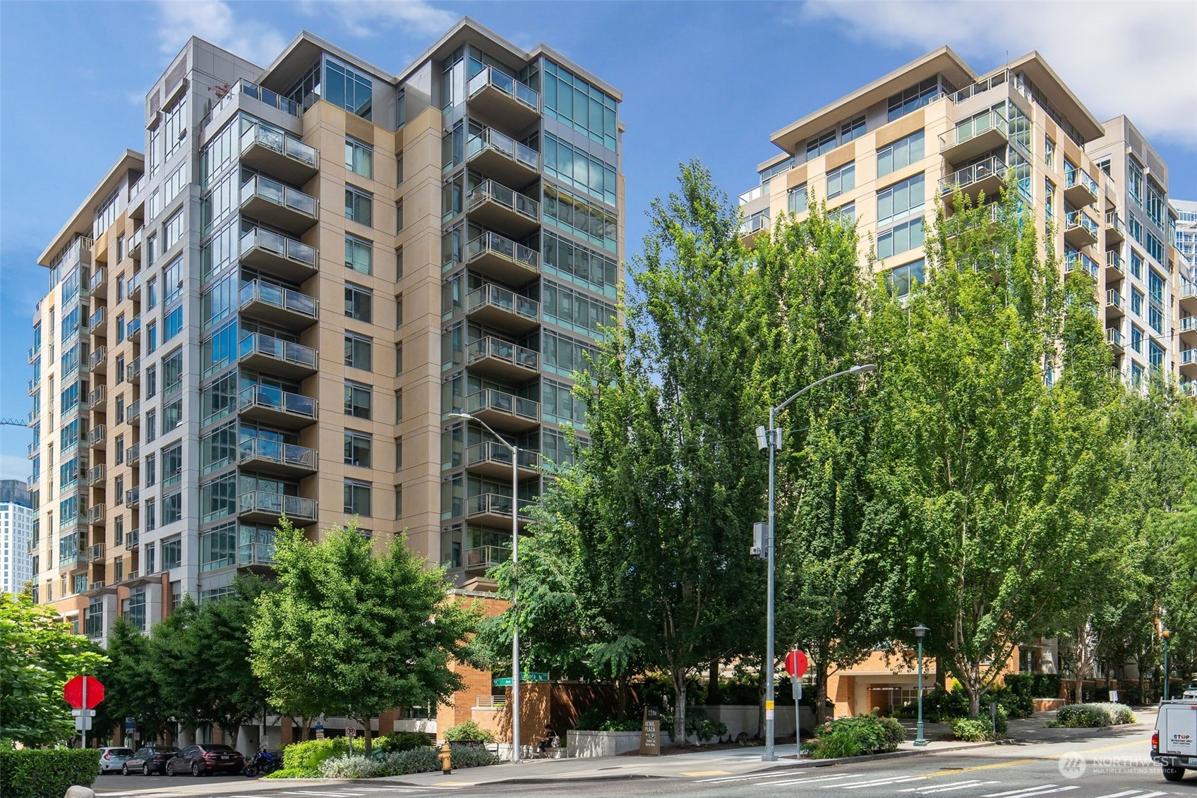 a view of a tall building next to a road